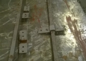 These support bars were put on to take the weight of the details above the void on the overthrow. These bars were a later addition to the original piece and will be reused.