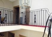 Wrought iron staircase with cast iron panels