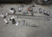Fixings including wall staple, two tension bar bolts and hangers which were used for the sign in the centre of the otherthrow