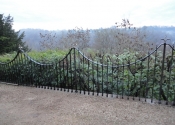 The Ironart restoration team reinstating the restored railings at Chalford