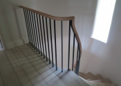 The curving bespoke stair balustrade complete with its oak handrail